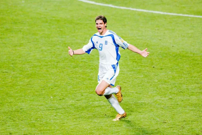 Angelos Charisteas of Greece celebrates his goal during the Euro final match between Portugal and Greece at Estadio da Luz in Lisbon, Portugal on July 4th, 2004. (Photo by Olivier Prevosto / Onze / Icon Sport  )   - Photo by Icon Sport