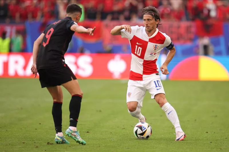 Luka Modri? (R) of Croatia and Jasir Asani (L) of Albania seen in action during the UEFA Euro 2024 group stage match between Croatia and Albania at Volksparkstadion. Final score; Croatia 2:2 Albania. (Photo by Sergei Mikhailichenko / SOPA Images/Sipa USA)   - Photo by Icon Sport