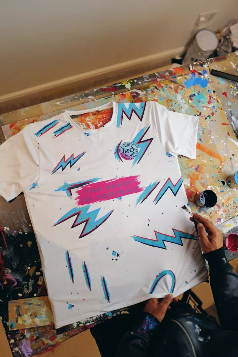 Why does this man paint lightning bolts on football shirts?