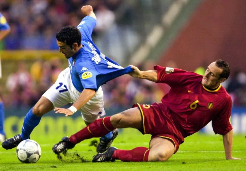 BRU026-20000614-BRUSSELS, BELGIUM :  Soccer Euro 2000 Tournament Belgium-Italy at Baudouin Stadium in Brussels - Belgium Red Devil defender Yves Vanderhaeghe fights for the ball with Italy's Gianluca Zambrotta.  BELGA PHOTO - Olivier Hoslet   Photo by Icon Sport   - Photo by Icon Sport